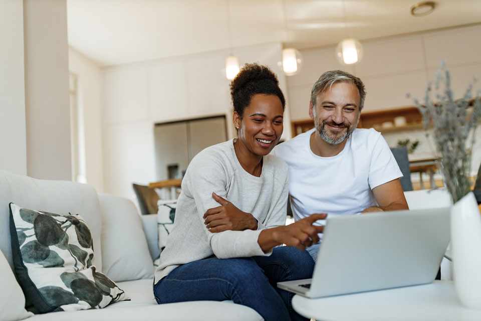 Young couple looking at a laptop