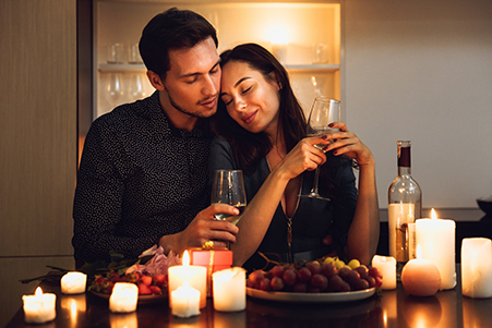 a couple surrounded by candles