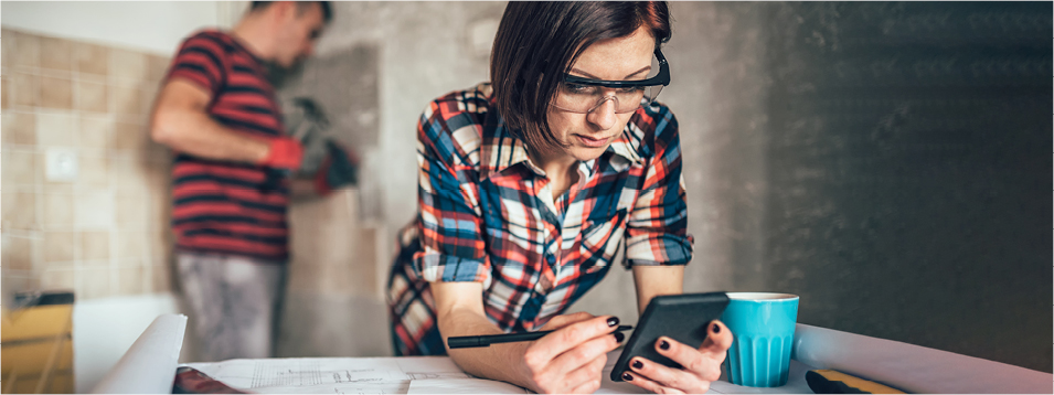 Woman looking at renovation plans