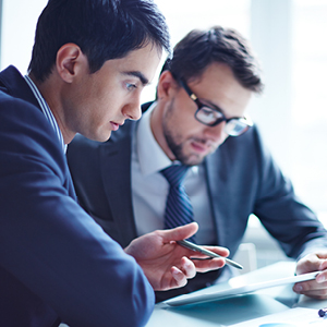 two workers looking at tablet