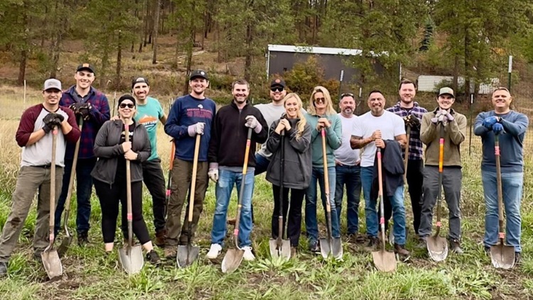 group of employees volunteering together outside