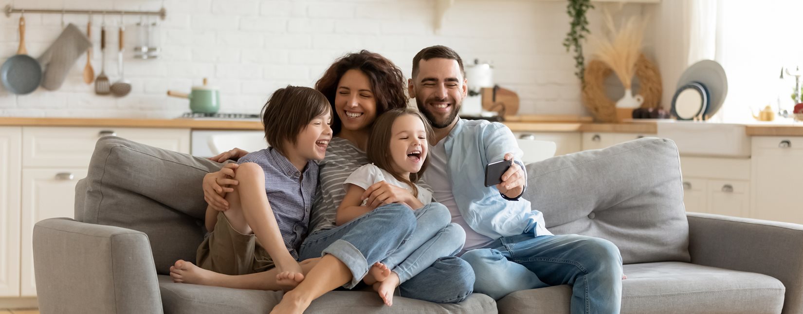 happy family sitting on couch